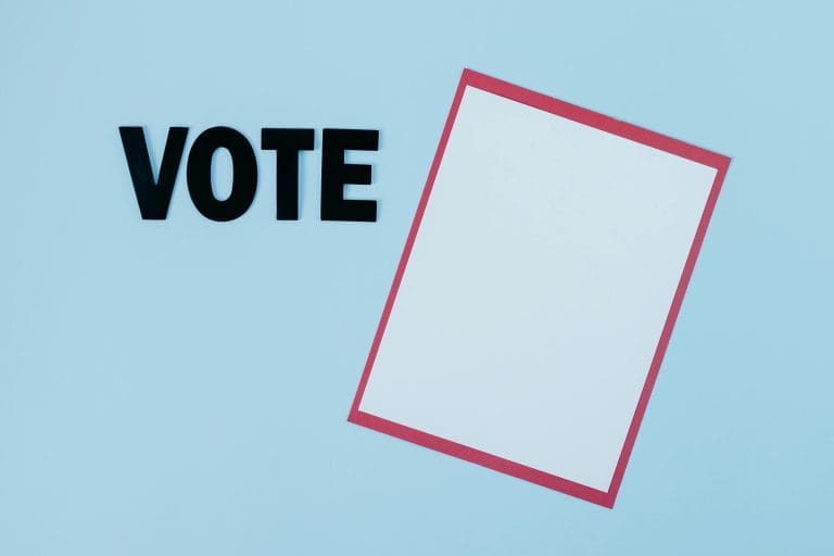 Simple conceptual image featuring the word 'VOTE' and blank paper, ideal for election themes.